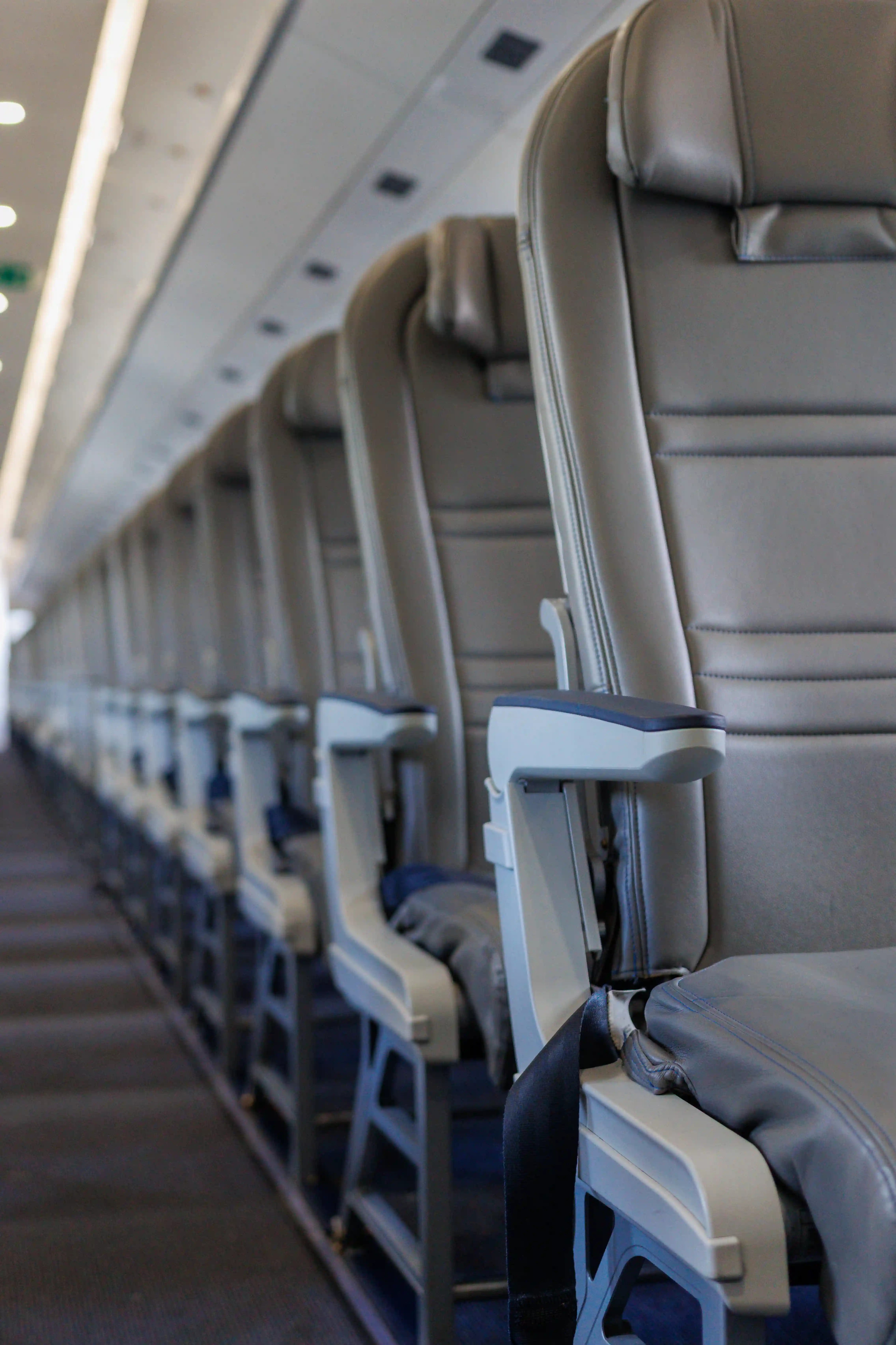 Empty airliner aisle and seats before boarding, ahead of pre-embarkation disinsection