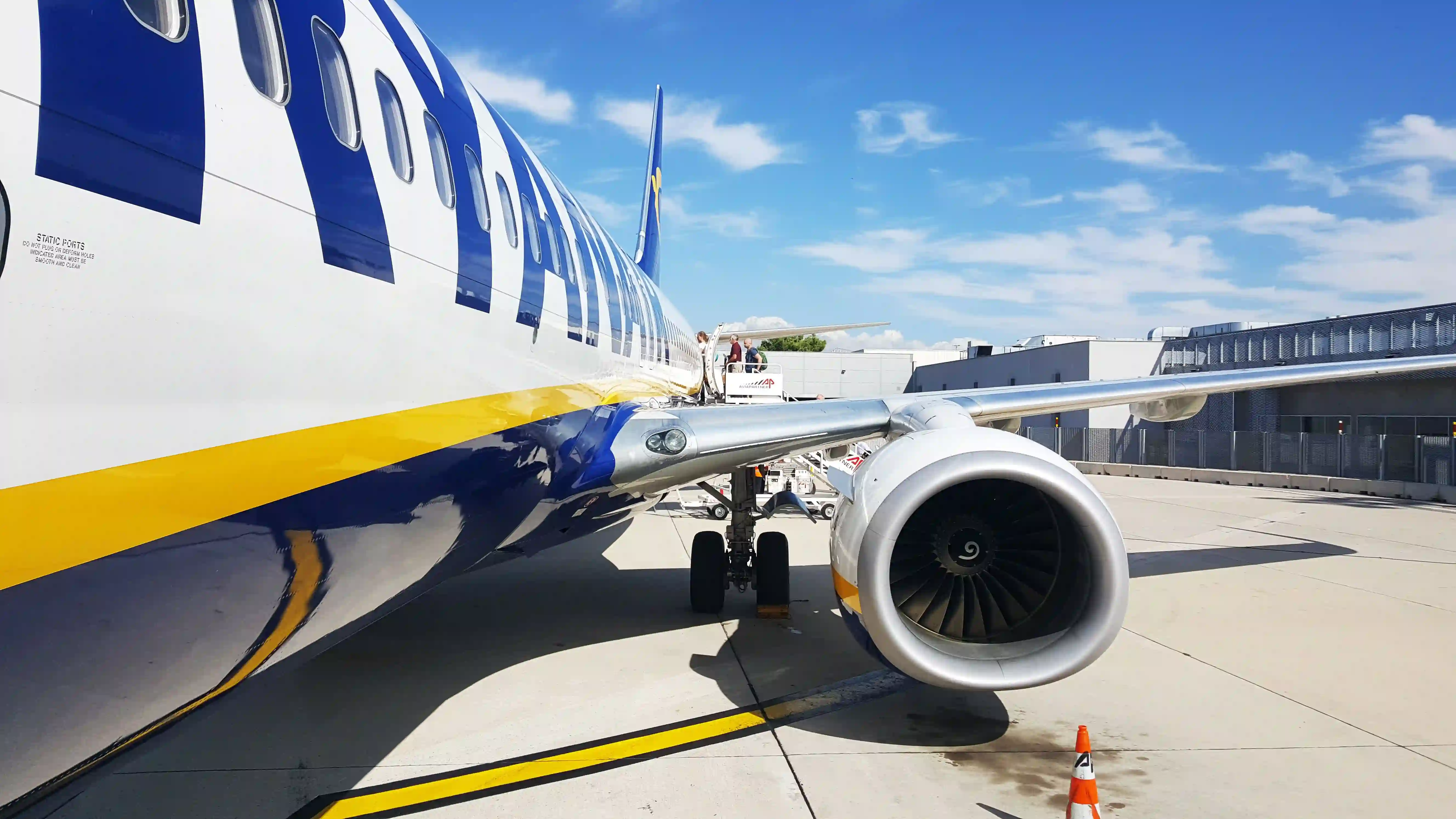 Airliner at the gate with the boarding bridge attached, after pre-embarkation disinsection