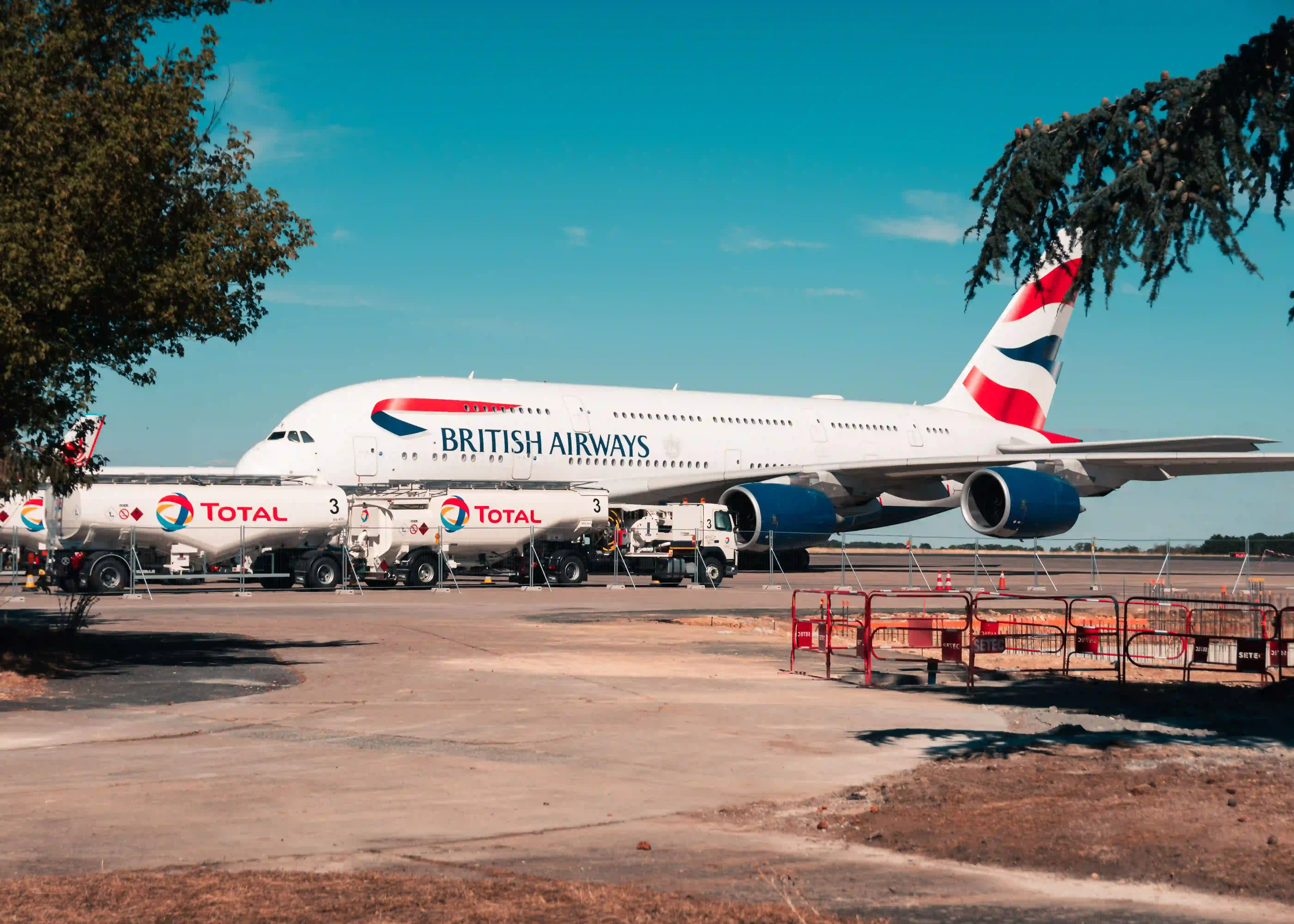 Airliner on a sunlit Mediterranean ramp before departure
