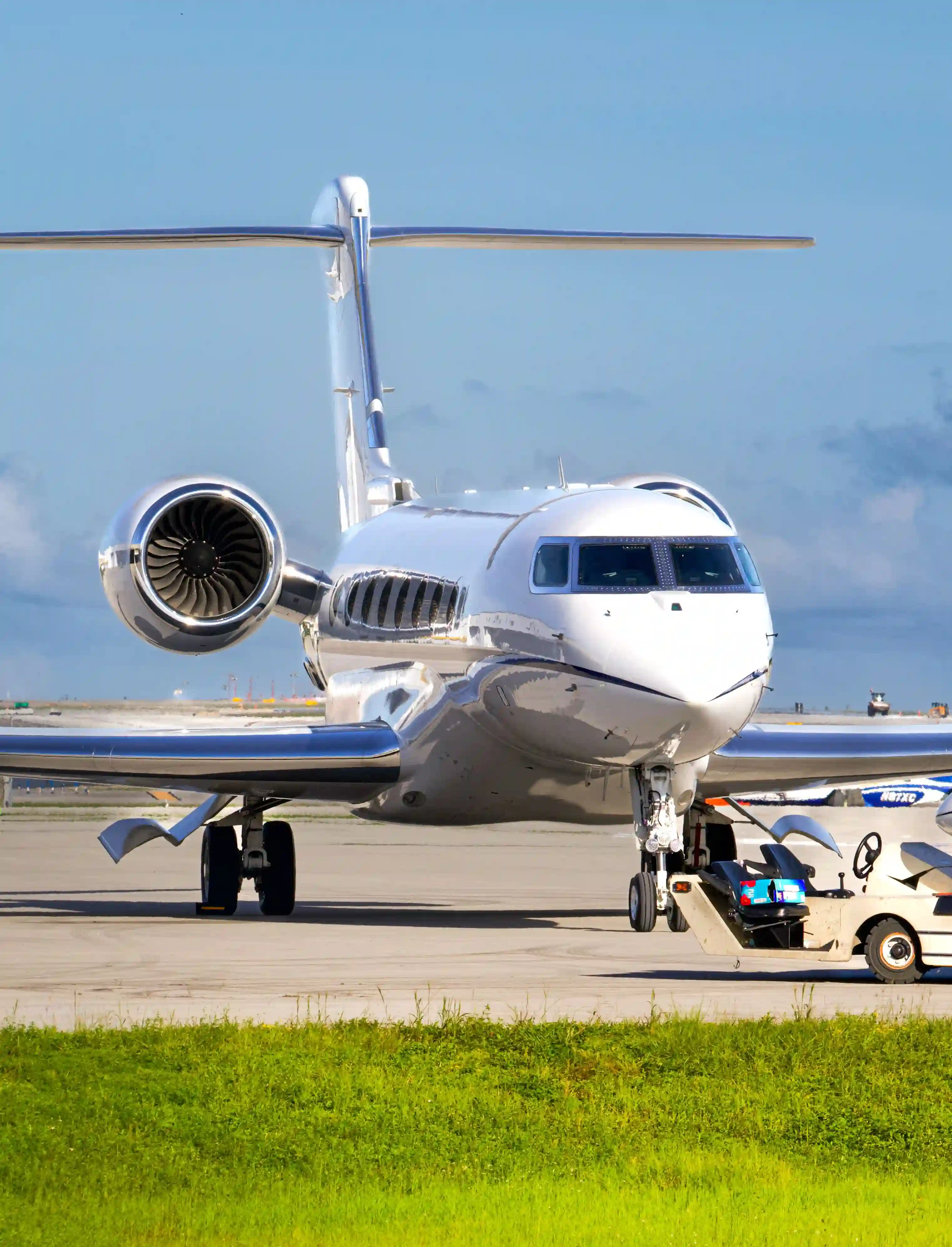 Large-cabin business jet on the ramp, nose and engines, before an international departure