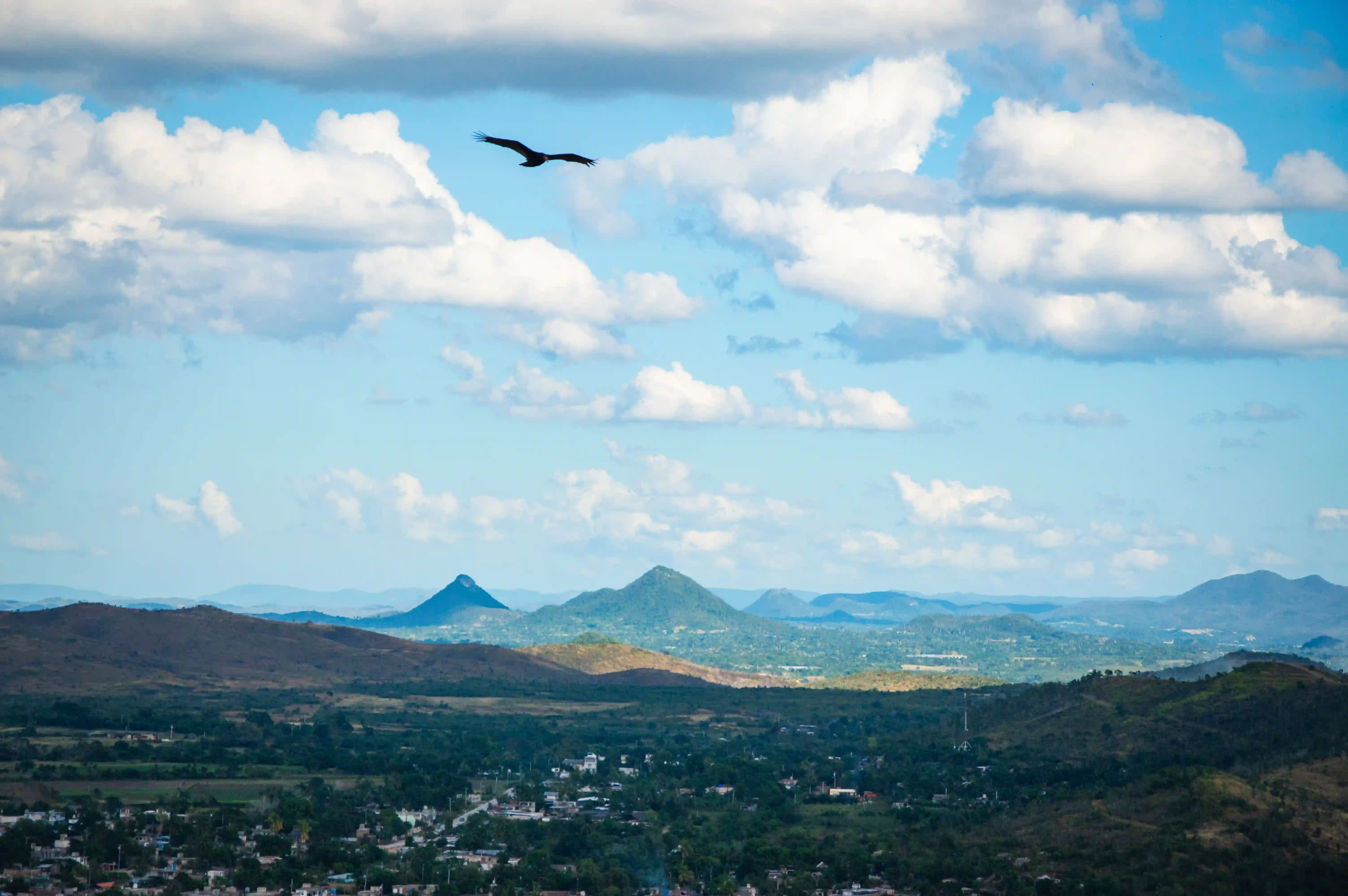 Green hills of the Paraguayan countryside under an open sky