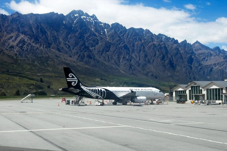 Aircraft on the ramp at Queenstown Airport, New Zealand, framed by the Remarkables
