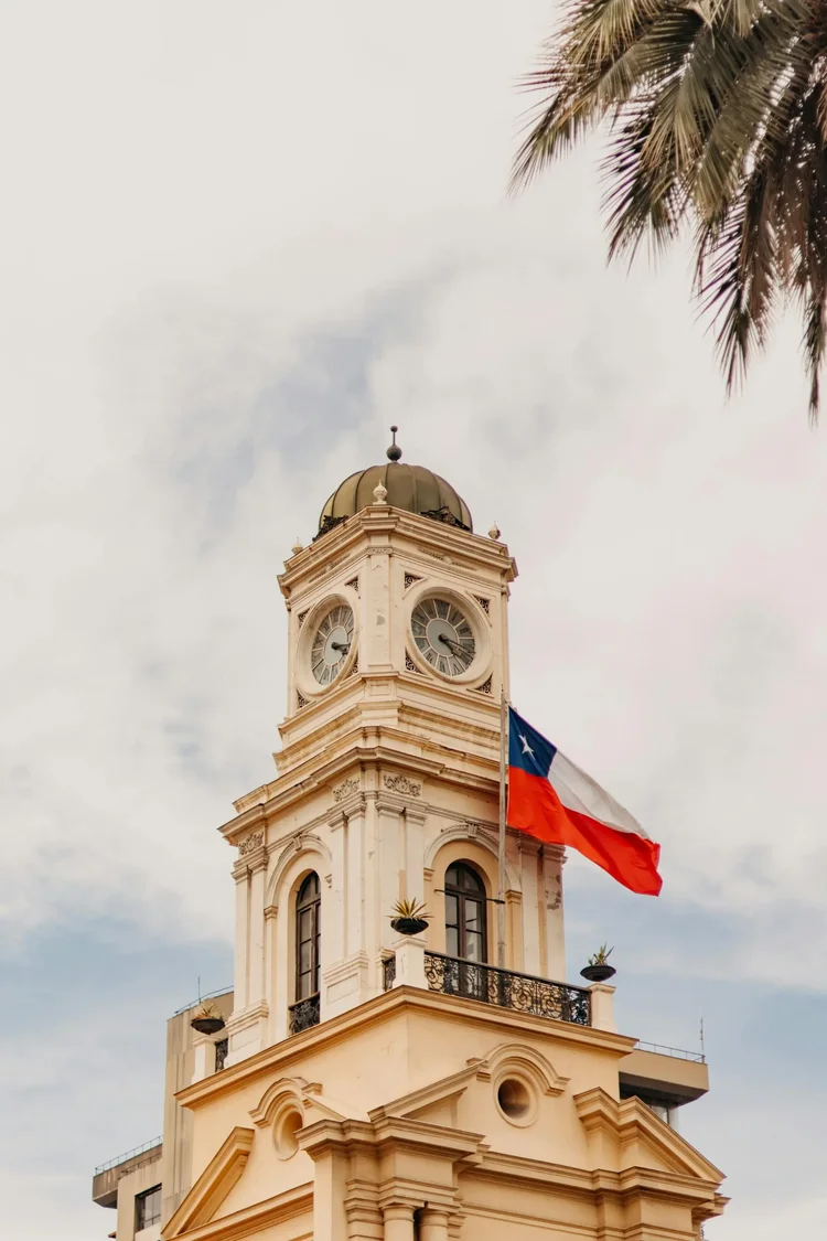 Chilean flag over a clock tower in Santiago